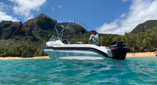 Reflex 485 boat on blue water just offshore