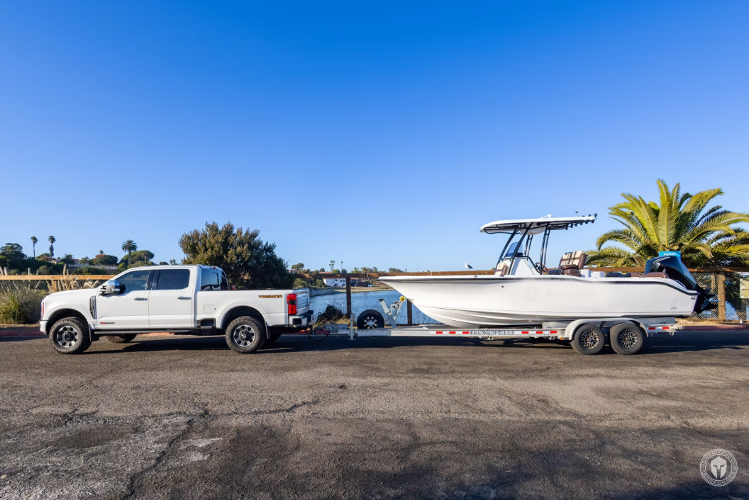 Florida 720 boat on trailer behind ute by the river